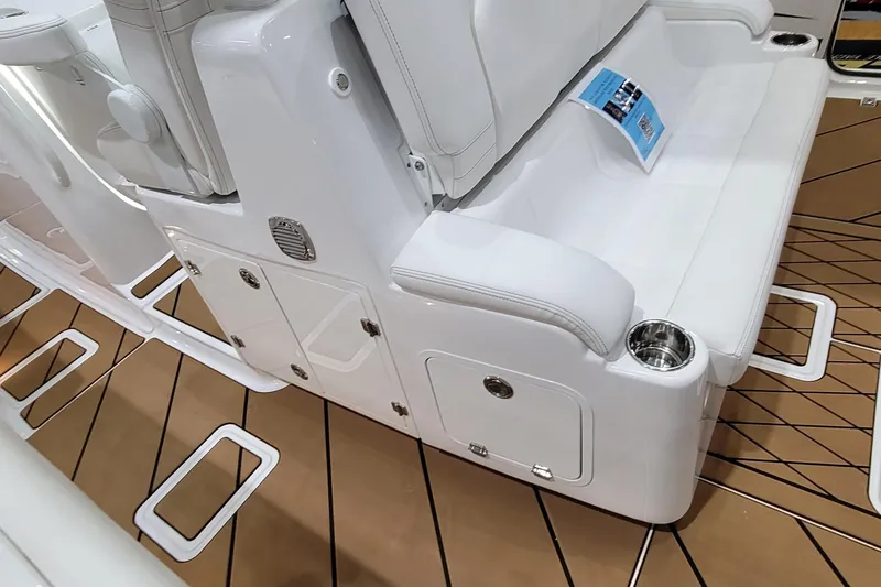 Slide: The Image of 2023 HCB 39 FT Speciale boat interior with white seating and cup holders. - 33