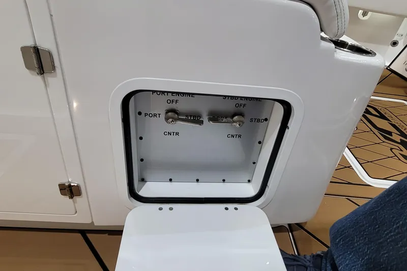 Slide: The Image of Control panel on 2023 HCB 39 FT Speciale boat, showing engine switches. - 34