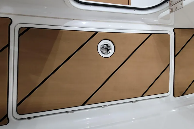 Slide: The Image of 2023 HCB 39 FT Speciale boat storage compartment with sleek wood paneling. - 39