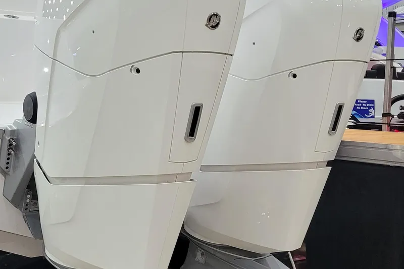 Slide: The Image of 2023 HCB 39 FT Speciale boat engines, sleek white design, close-up view. - 4