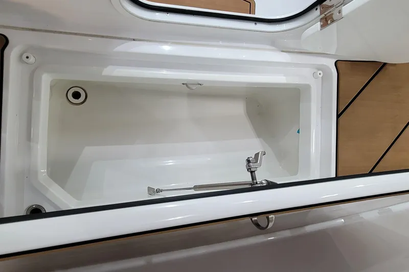 Slide: The Image of Open storage compartment on 2023 HCB 39 FT Speciale boat, featuring sleek design. - 40