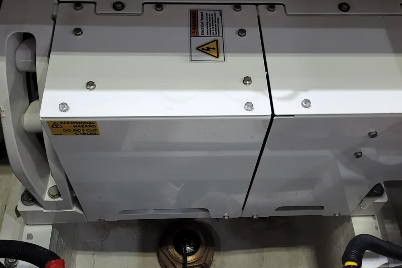 Slide: The Image of Engine compartment of 2023 HCB 39 FT Speciale with electrical hazard warning. - 41