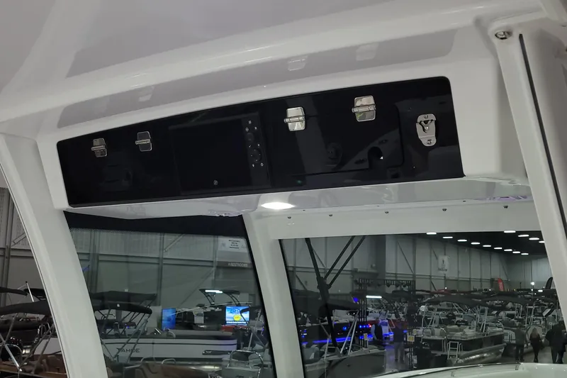 Slide: The Image of 2023 HCB 39 FT Speciale boat interior with overhead storage and control panel. - 47