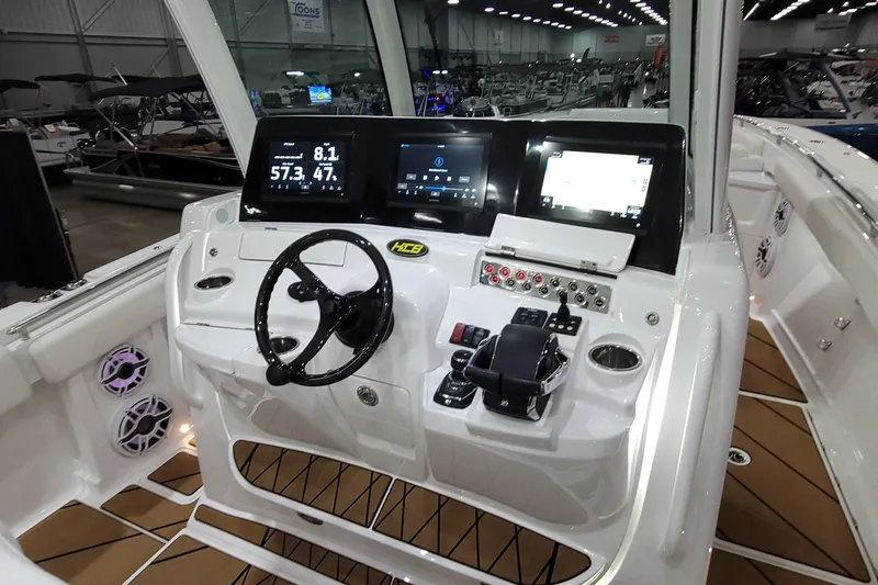 Slide: The Image of 2023 HCB 39 FT Speciale boat dashboard with modern controls and digital displays. - 51