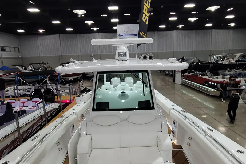 Slide: The Image of 2023 HCB 39 FT Speciale boat showcased indoors at a marine exhibition. - 56