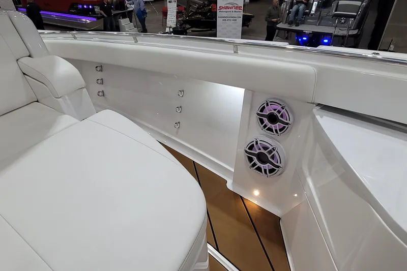 Slide: The Image of 2023 HCB 39 FT Speciale boat interior with white seating and built-in speakers. - 59