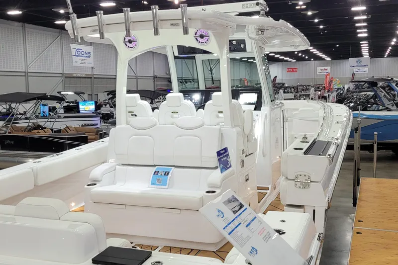 Slide: The Image of 2023 HCB 39 FT Speciale boat displayed at an indoor boat show. - 9