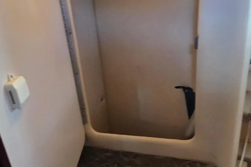 Slide: The Image of Interior storage compartment of 2004 Sea Ray 260 Sundancer boat. - 26