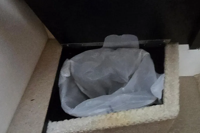 Slide: The Image of Trash bin with liner inside a 2004 Sea Ray 260 Sundancer boat. - 35