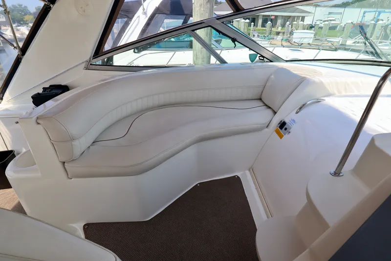 Slide: The Image of Interior of 2000 Cruisers Yachts 3870 with beige seating area. - 12