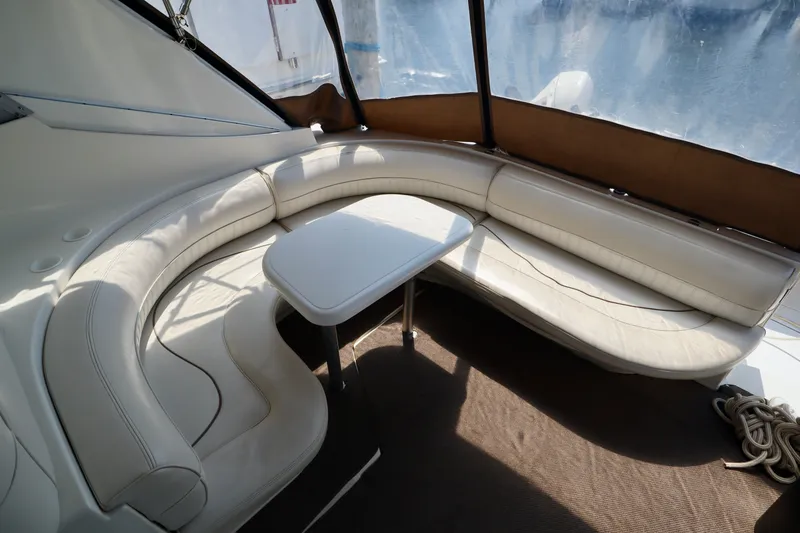 Slide: The Image of Interior of 2000 Cruisers Yachts 3870 with curved leather seating. - 16