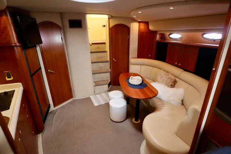 Slide: The Image of Interior of a 2000 Cruisers Yachts 3870 with elegant seating area. - 5