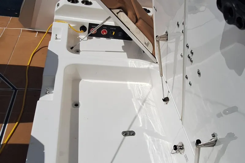 Slide: The Image of 2021 Aviara AV32 OB boat deck with storage compartment and control panel. - 13