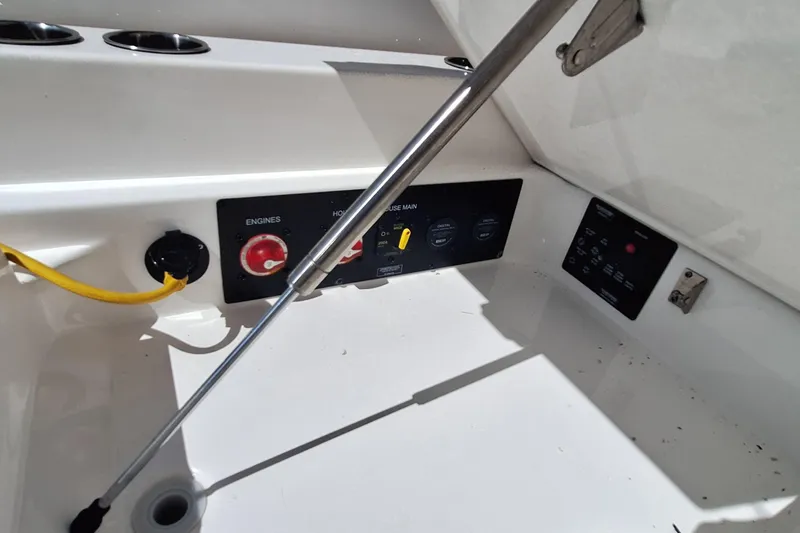 Slide: The Image of Control panel of a 2021 Aviara AV32 OB boat, featuring engine and power switches. - 14