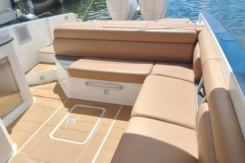Slide: The Image of Luxurious seating on 2021 Aviara AV32 OB boat with tan upholstery and sleek design. - 17