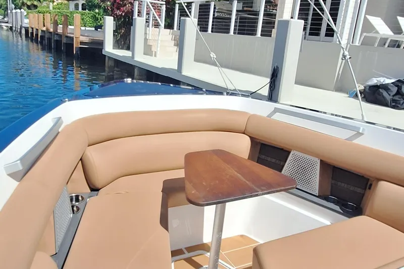 Slide: The Image of Luxurious seating area on 2021 Aviara AV32 OB boat with wooden table. - 20