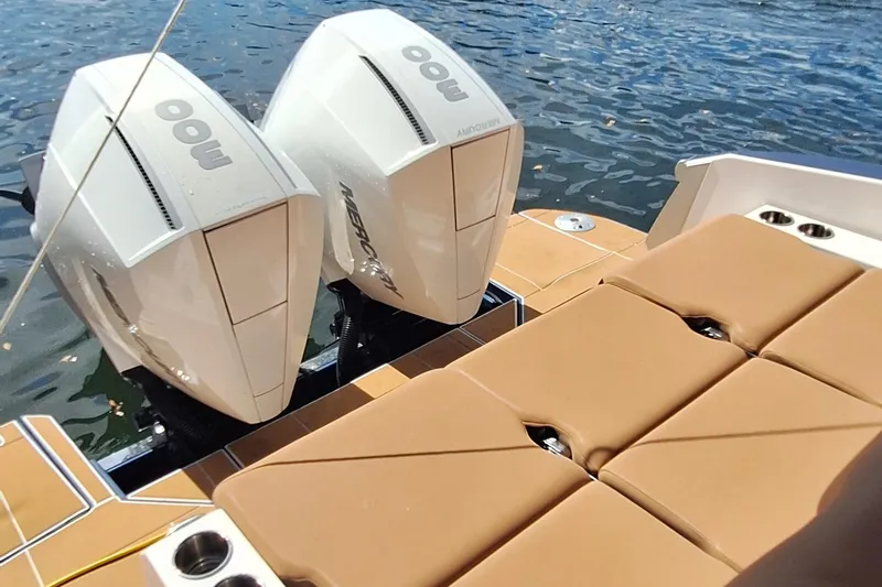 Slide: The Image of 2021 Aviara AV32 OB boat with twin Mercury outboard engines and tan seating. - 9