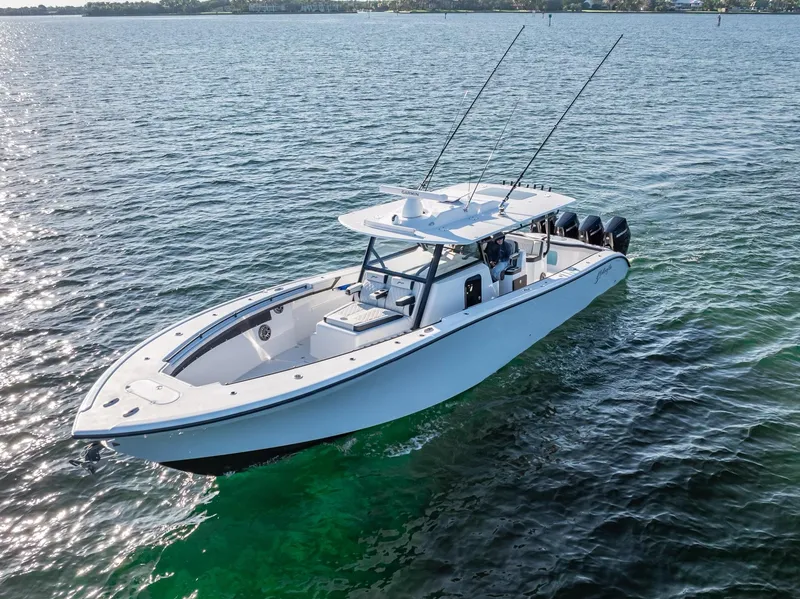 Slide: The Image of 2024 Yellowfin 42 boat on open water with fishing rods. - 25