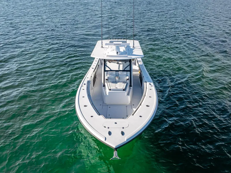 Slide: The Image of 2024 Yellowfin 42 boat on clear blue water. - 26