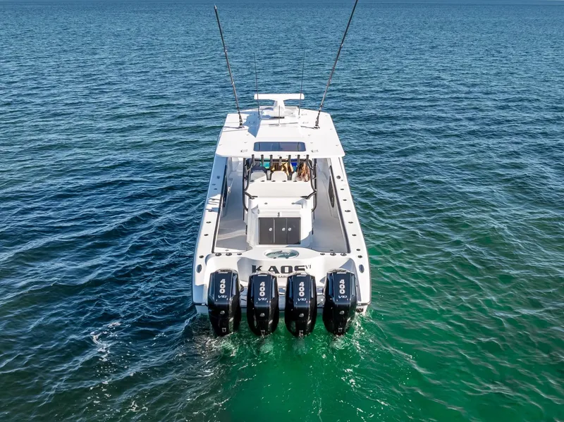 Slide: The Image of 2024 Yellowfin 42 boat with quad outboard engines on open water. - 28