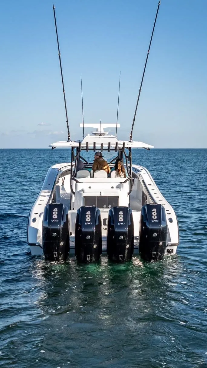 Slide: The Image of 2024 Yellowfin 42 boat with four powerful outboard engines on open water. - 30