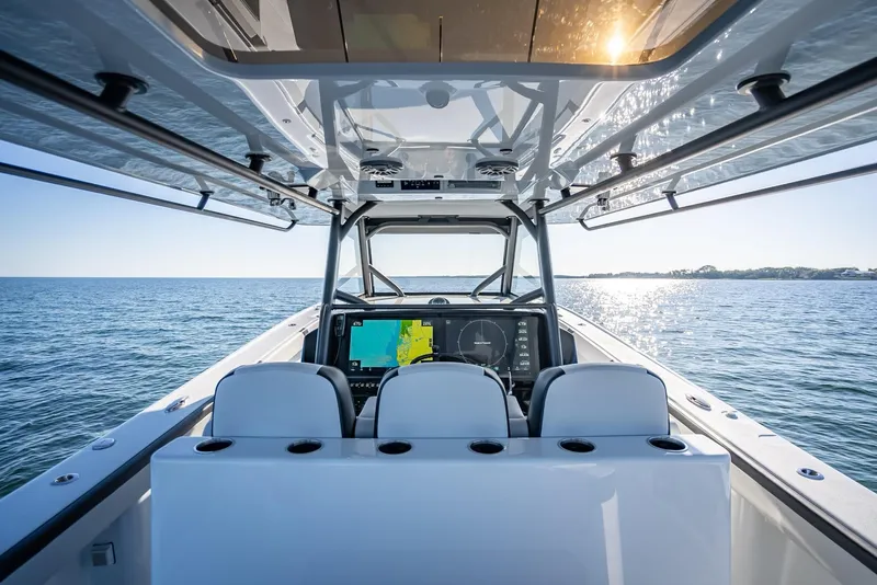 Slide: The Image of 2024 Yellowfin 42 boat interior with advanced navigation system on open water. - 35