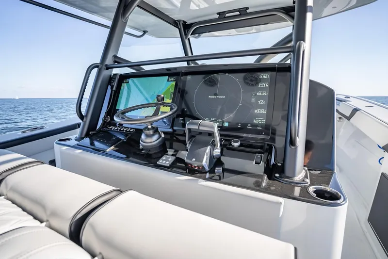 Slide: The Image of 2024 Yellowfin 42 boat dashboard with advanced navigation system and controls. - 36