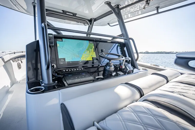 Slide: The Image of 2024 Yellowfin 42 boat helm with advanced navigation system and luxurious seating. - 39