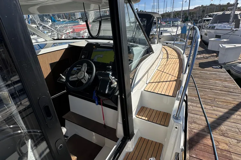 Slide: The Image of 2023 Beneteau Antares 11 Fly cockpit and deck, docked at marina. - 16