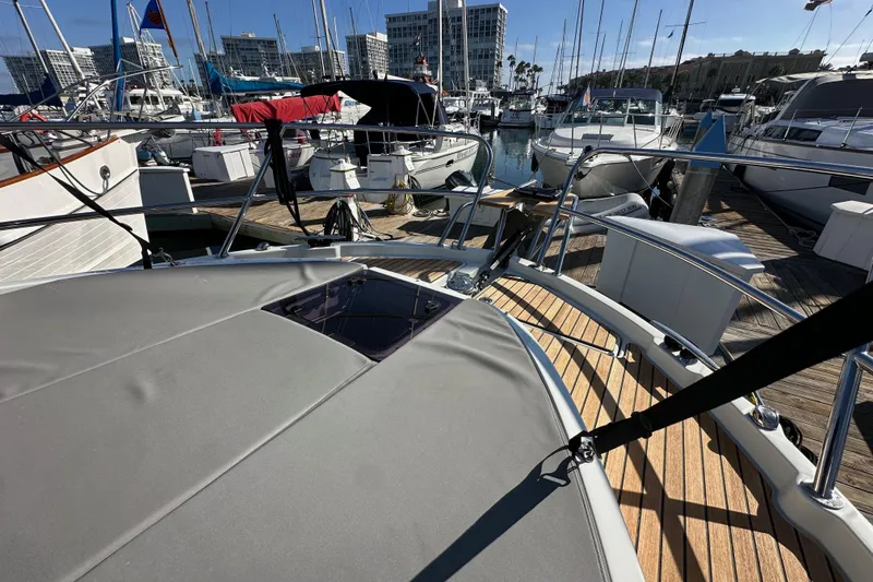 Slide: The Image of 2023 Beneteau Antares 11 Fly yacht docked at marina with other boats. - 18