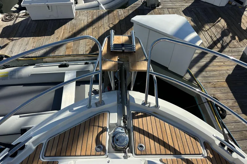 Slide: The Image of Bow view of 2023 Beneteau Antares 11 Fly with teak decking and stainless steel railings. - 19