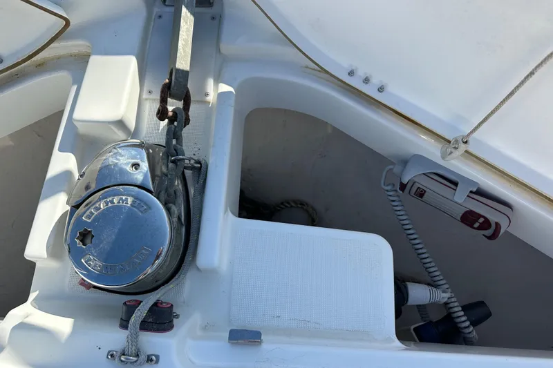 Slide: The Image of Anchor winch and storage compartment on 2023 Beneteau Antares 11 Fly boat. - 21