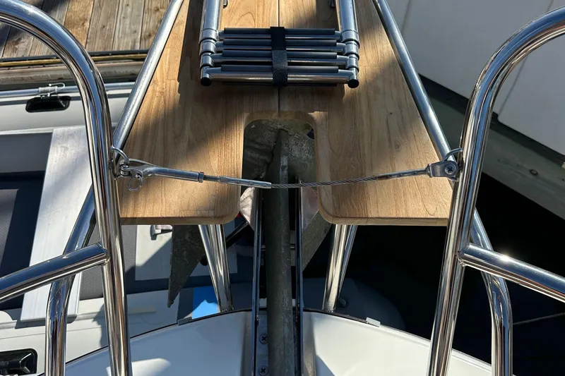 Slide: The Image of Bow view of 2023 Beneteau Antares 11 Fly with anchor and wooden deck detail. - 22