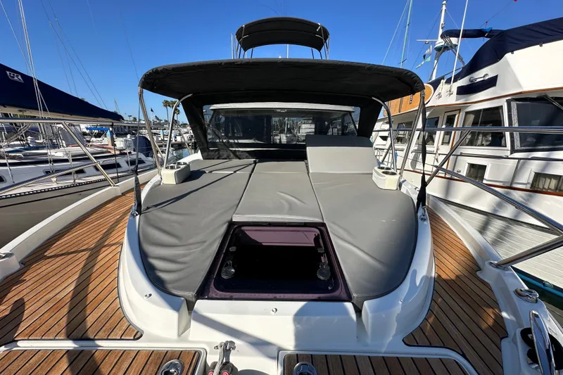 Slide: The Image of 2023 Beneteau Antares 11 Fly yacht with sun deck, docked in marina. - 23