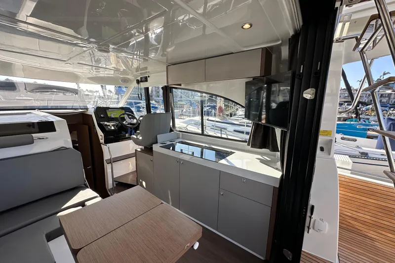 Slide: The Image of Interior of 2023 Beneteau Antares 11 Fly, featuring modern helm and seating area. - 28