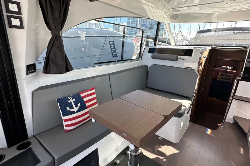 Slide: The Image of Interior of 2023 Beneteau Antares 11 Fly with seating, table, and nautical decor. - 29