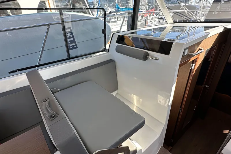 Slide: The Image of Interior of 2023 Beneteau Antares 11 Fly, featuring modern seating and sleek design. - 31