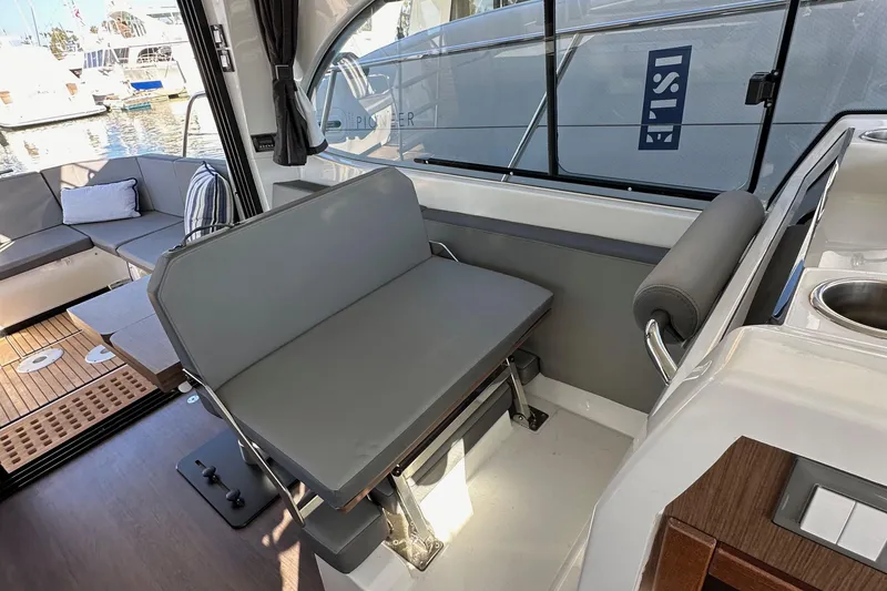 Slide: The Image of Interior of 2023 Beneteau Antares 11 Fly, featuring seating and modern design elements. - 32