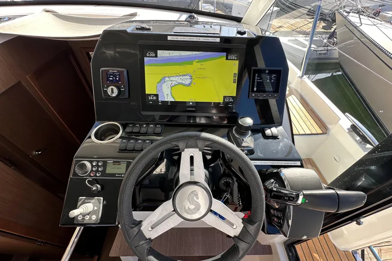 Slide: The Image of Cockpit of 2023 Beneteau Antares 11 Fly with navigation controls and display. - 38