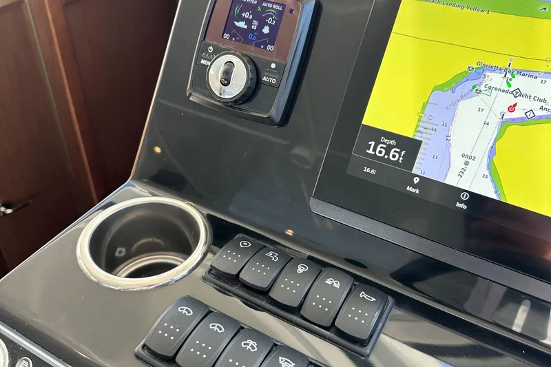 Slide: The Image of Control panel of 2023 Beneteau Antares 11 Fly with navigation display and switches. - 40
