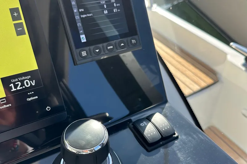 Slide: The Image of Control panel of 2023 Beneteau Antares 11 Fly, displaying unit voltage and engine hours. - 42