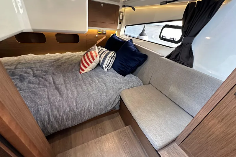 Slide: The Image of Luxurious cabin interior of 2023 Beneteau Antares 11 Fly with cozy bedding and seating. - 48