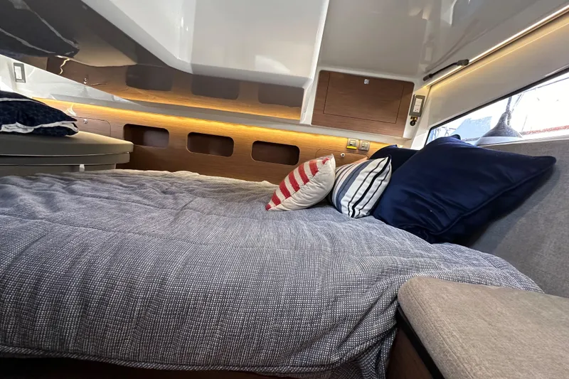 Slide: The Image of Luxurious cabin interior of 2023 Beneteau Antares 11 Fly with cozy bedding and pillows. - 49