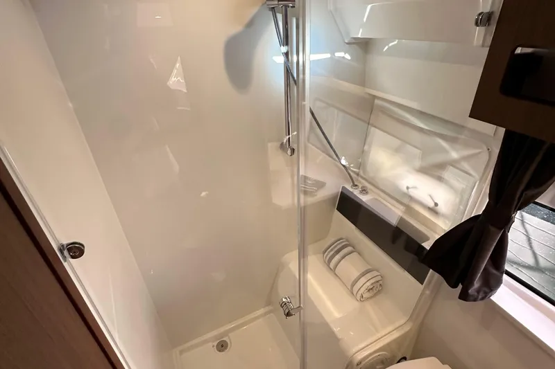 Slide: The Image of Modern bathroom interior of 2023 Beneteau Antares 11 Fly yacht, featuring sleek shower design. - 59