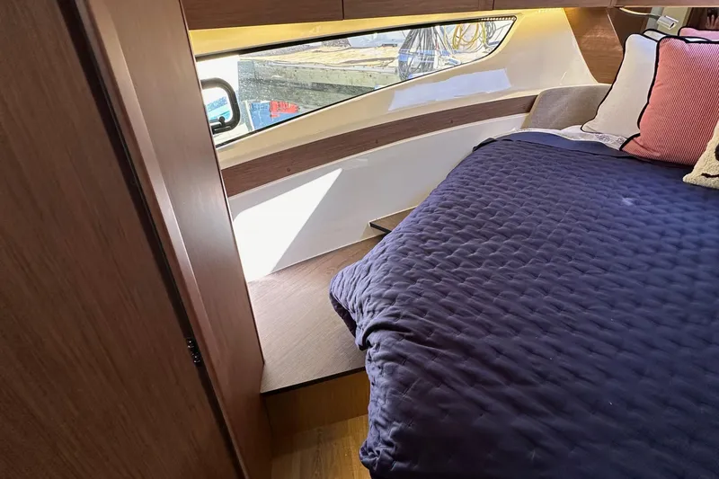 Slide: The Image of Luxurious cabin interior of 2023 Beneteau Antares 11 Fly with cozy bedding and modern design. - 65