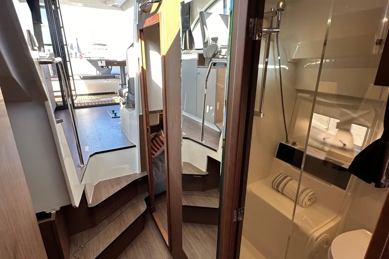 Slide: The Image of Interior of 2023 Beneteau Antares 11 Fly, featuring modern bathroom and sleek design. - 71