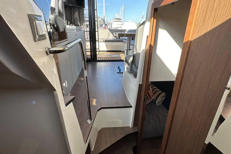 Slide: The Image of Interior view of 2023 Beneteau Antares 11 Fly, showcasing modern design and wood finishes. - 72