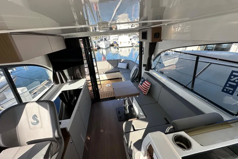 Slide: The Image of Interior of 2023 Beneteau Antares 11 Fly, featuring modern seating and sleek design. - 73