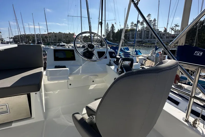 Slide: The Image of 2023 Beneteau Antares 11 Fly helm with steering wheel and navigation screens. - 80