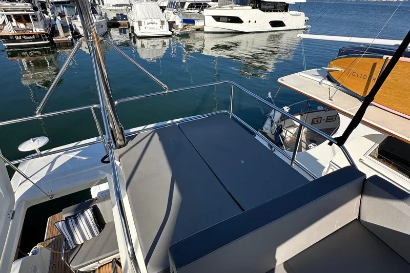 Slide: The Image of Flybridge view of 2023 Beneteau Antares 11 Fly yacht docked at marina. - 83